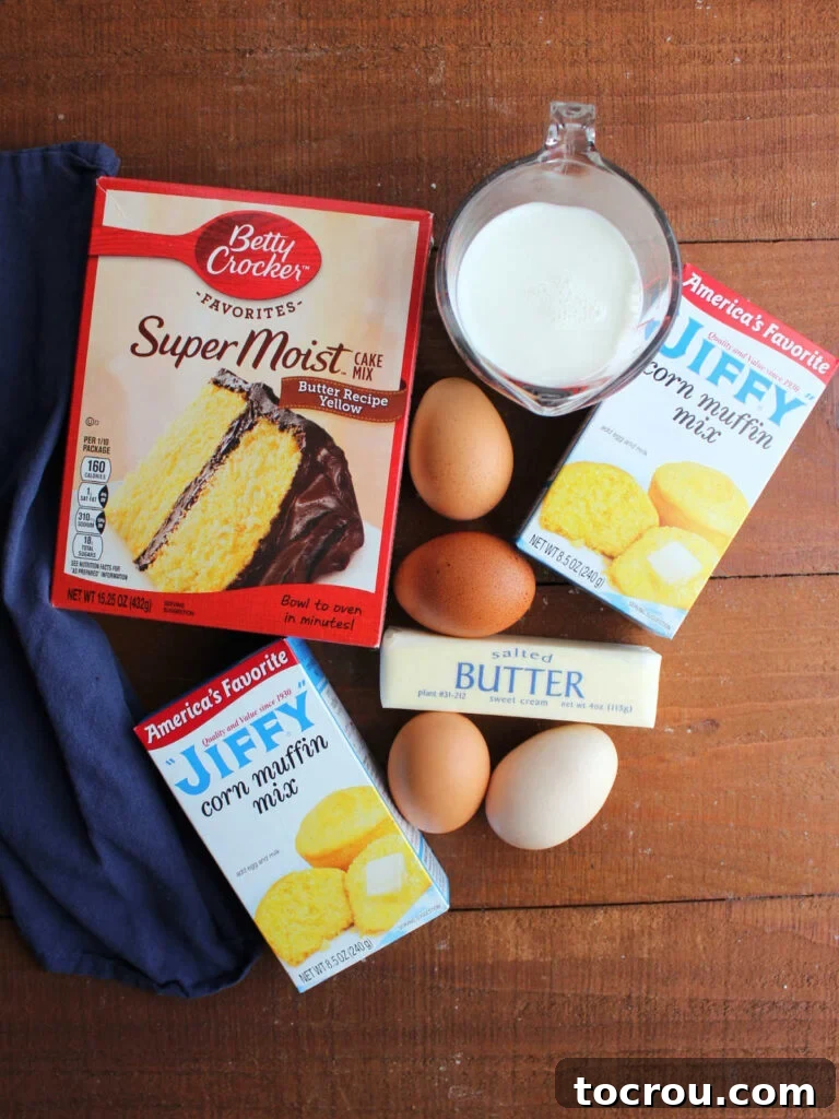 Simple Cornbread Ingredients Key ingredients for sweet cakey cornbread: yellow cake mix, Jiffy corn muffin mix, eggs, milk, and melted butter, laid out before mixing.