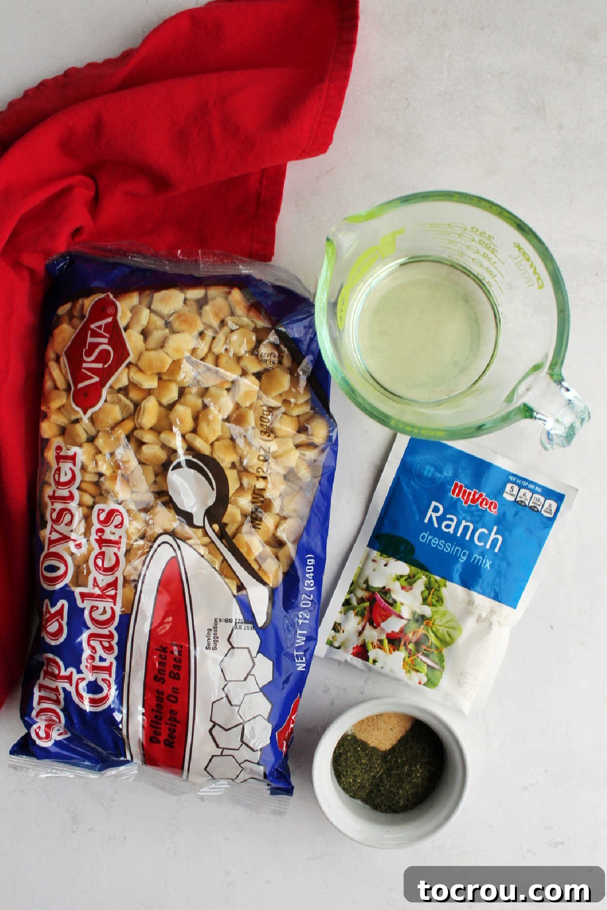 Ingredients: oyster crackers, ranch seasoning mix, garlic, dill and oil ready to be made into ranch soup crackers snack mix.