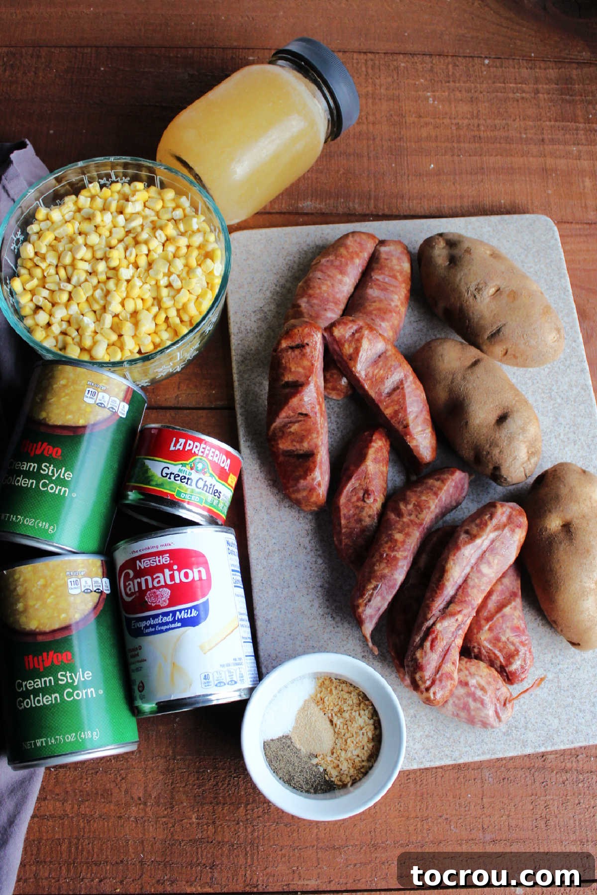 Ingredients: corn, creamed corn, potatoes, sausage, green chilies, evaporated milk, chicken stock and seasonings ready to be made into chowder.