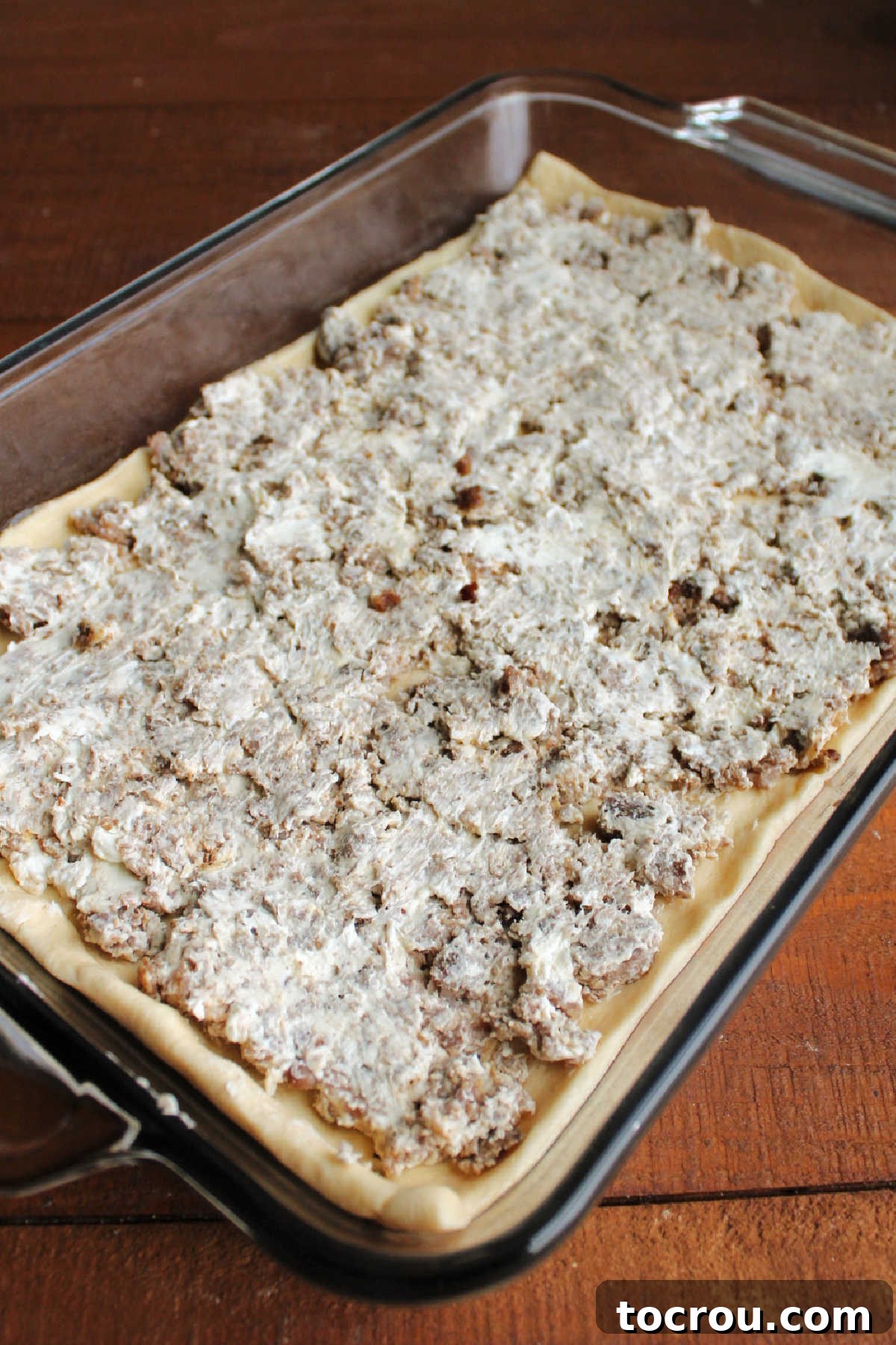 Savory Sausage Cream Cheese Puffs 6 Cream cheese and sausage layer over the top of the bottom crescent dough.