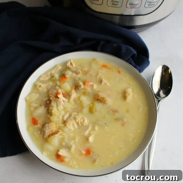 Delicious Greek Lemon Chicken Soup A tantalizing close-up of a bowl of Greek lemon chicken soup, garnished and ready to be savored, showcasing its rich texture and vibrant colors.