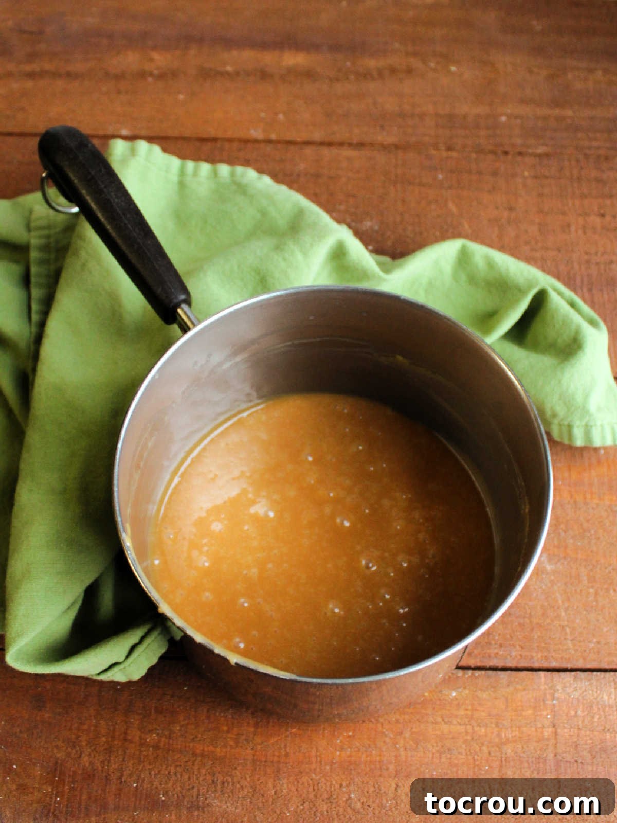 Golden Caramel Pecan Delight 5 Melted caramel sauce in saucepan, ready to be made into pie filling.