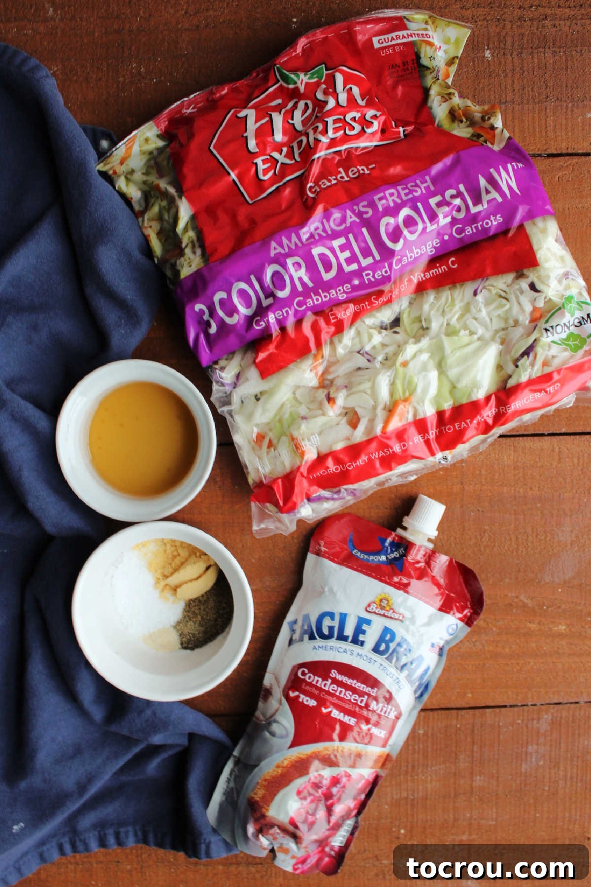 Coleslaw Ingredients Ingredients for condensed milk coleslaw: bagged coleslaw mix, condensed milk, vinegar, mustard powder, salt, pepper, and celery seeds.