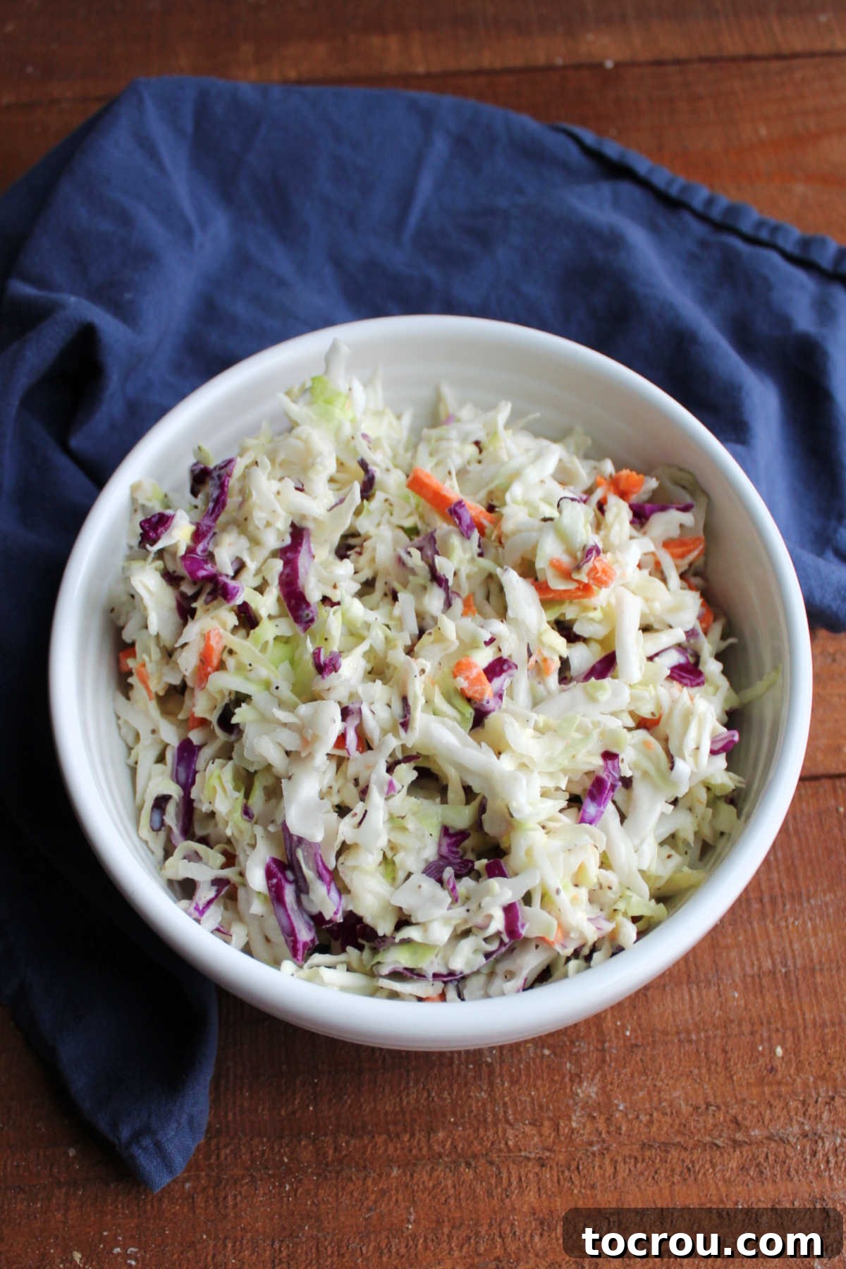 Creamy Coleslaw Ready Serving bowl filled with coleslaw dressed with a creamy homemade condensed milk dressing, ready to be served.