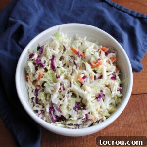 Bowl of creamy coleslaw with homemade condensed milk dressing.