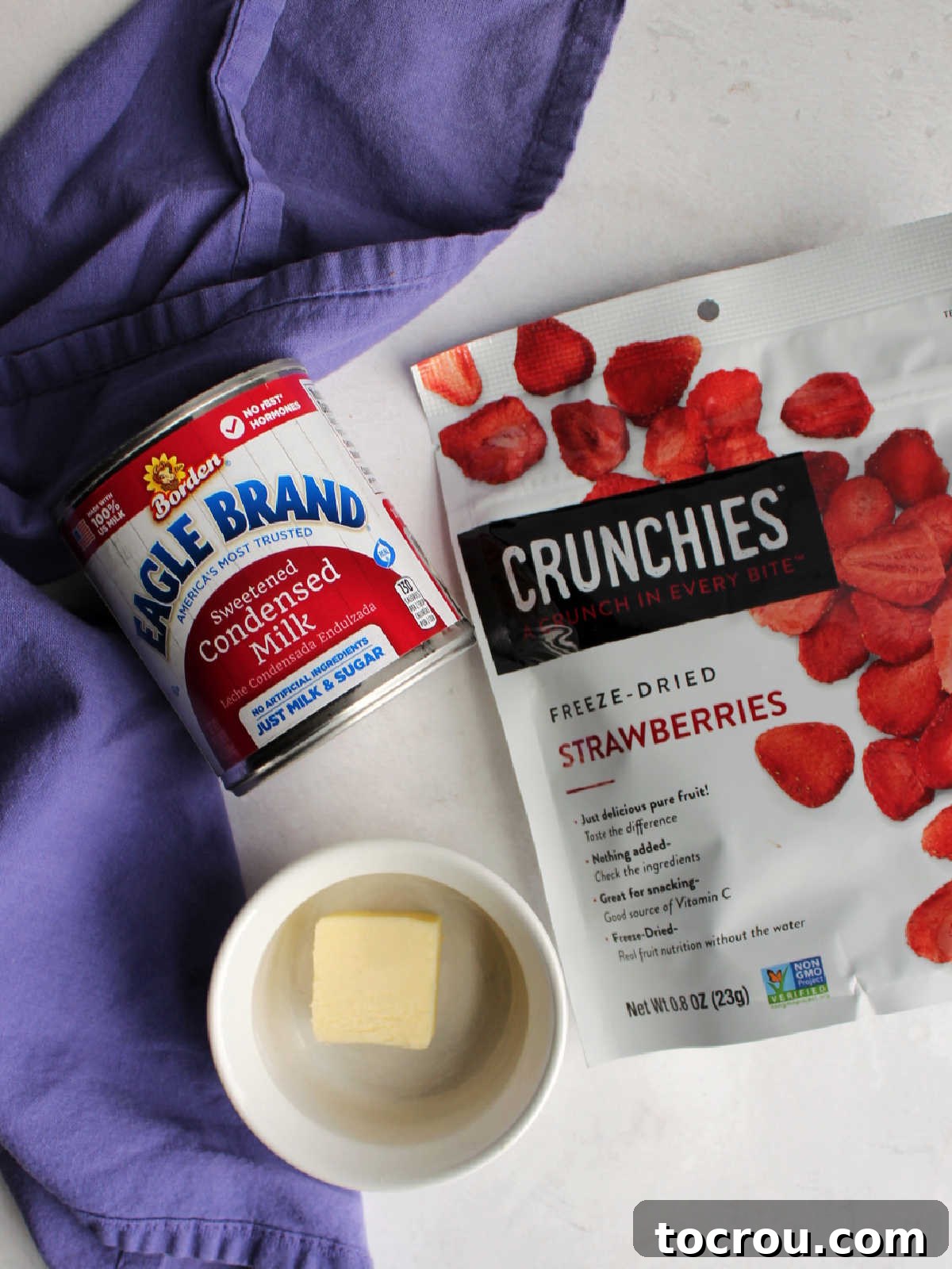 Ingredients: butter, condensed milk and package of freeze dried strawberries ready to be made into candy.