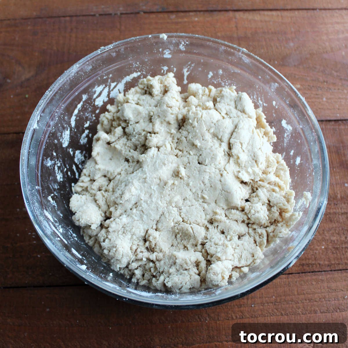 Rough Biscuit Dough in Mixing Bowl Mixing bowl with a rough mass of biscuit dough in it, ready to be patted out and cut.