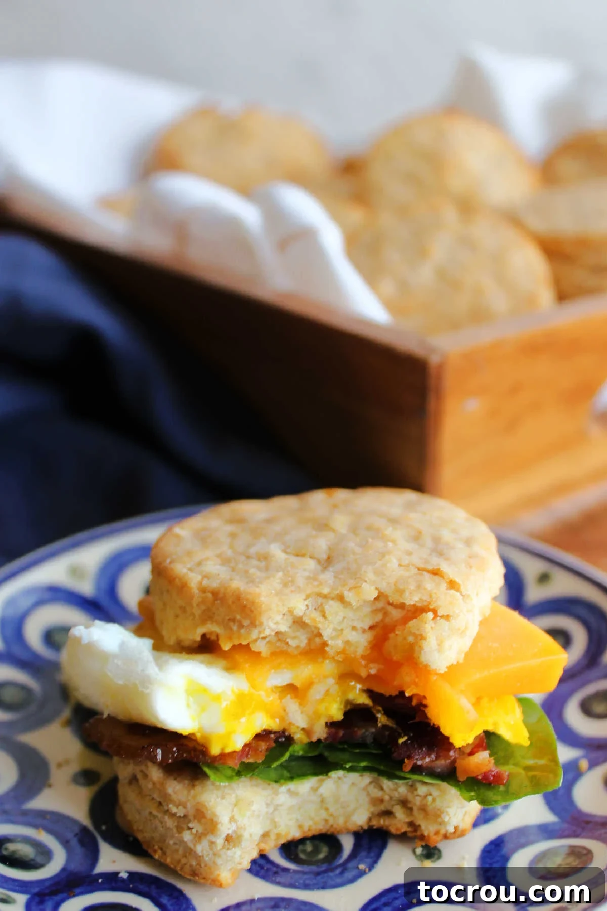 Lard Biscuit Breakfast Sandwich Biscuit made into a breakfast sandwich with eggs, cheddar, bacon and spinach.