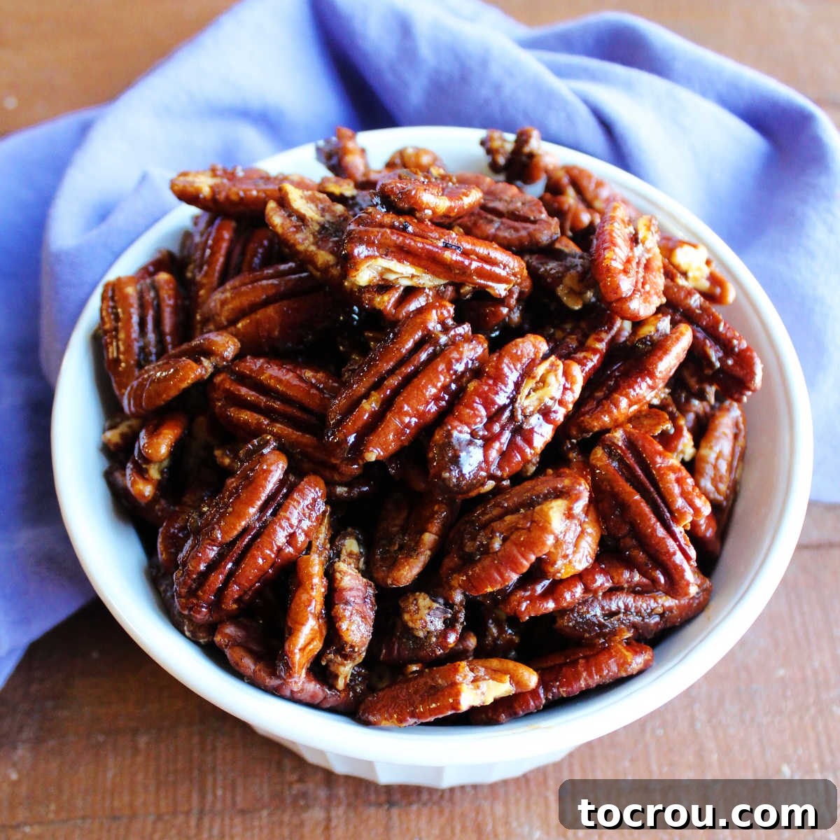 Southern Spiced Pecans Bowl of perfectly seasoned Southern spiced pecans, ready to be enjoyed.