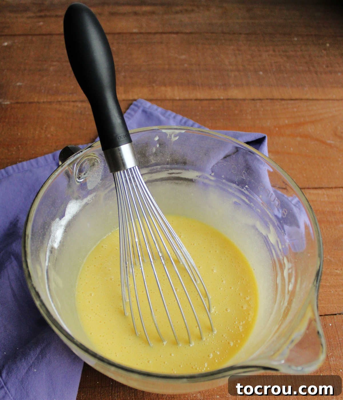 Mixing bowl with cake batter inside.
