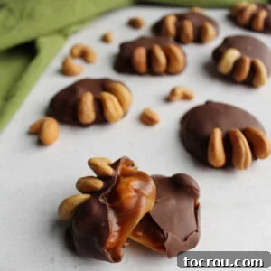 Inside of bear paw candy with soft caramel showing and cashew claws.