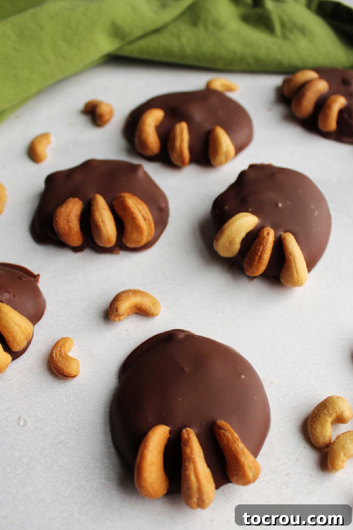 Finished Milk Chocolate Bear Paws Milk chocolate covered caramel and cashew bear paw candies.