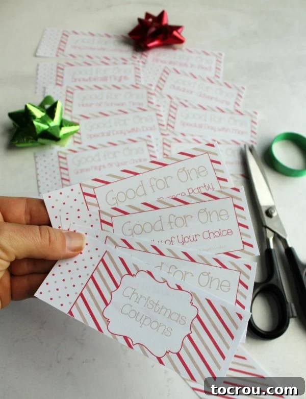 Enjoy the magic of Christmas and make memories with your favorite kiddos by printing this free coupon book and enjoying the activities. You can have your coupon book put together in just a couple of minutes and have memories that will last a lifetime! cutting out free printable pages to make a kid's coupon book for Christmas.