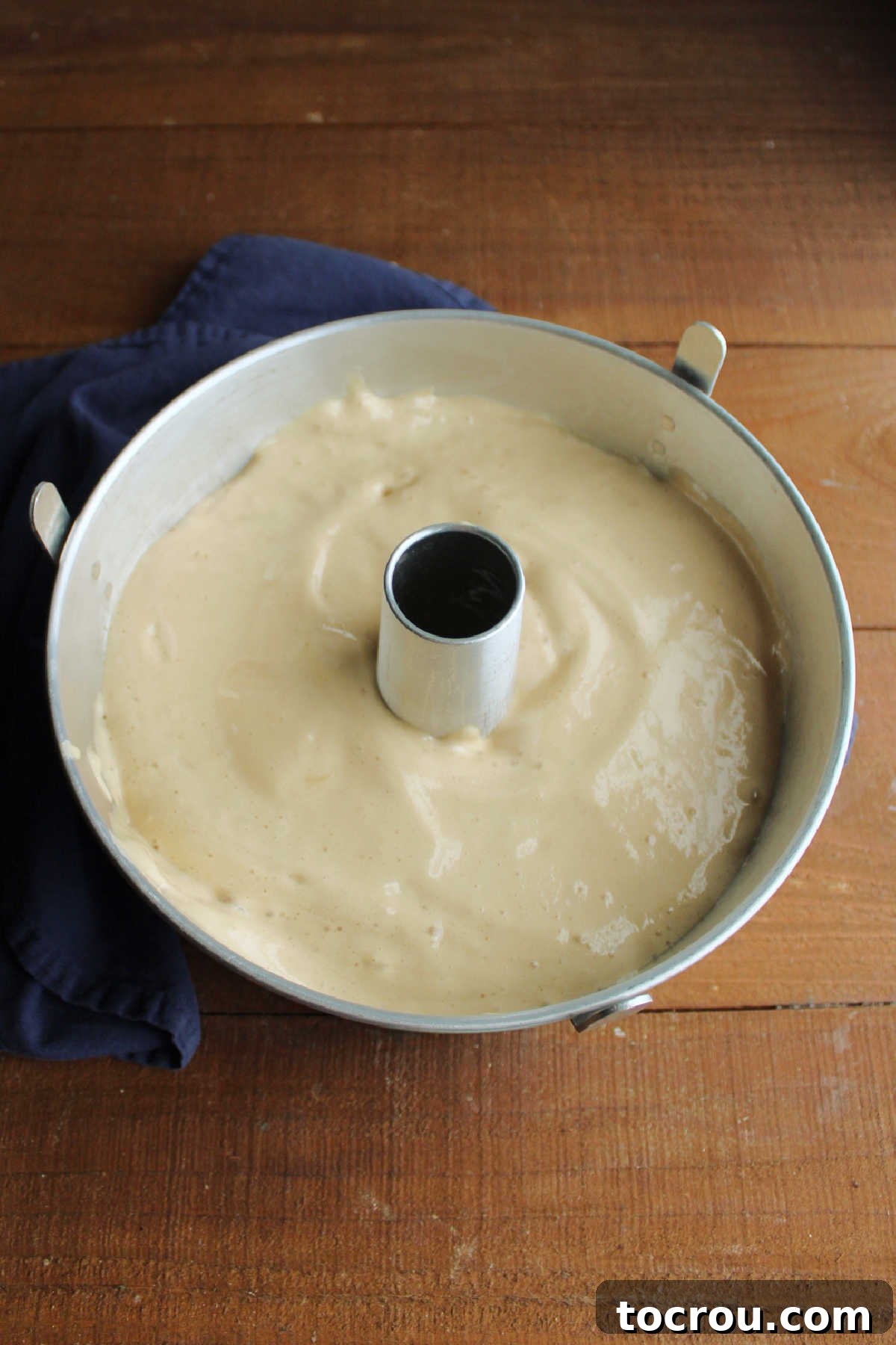 Coffee angel food cake batter in tube pan ready to bake.