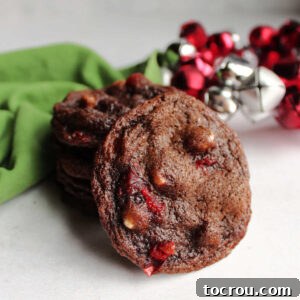 Chocolate cookie with white chips and bits of maraschino cherry baked inside.