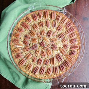 A pie plate brimming with freshly baked pecan pie baked oatmeal, straight from the oven and ready to be enjoyed.