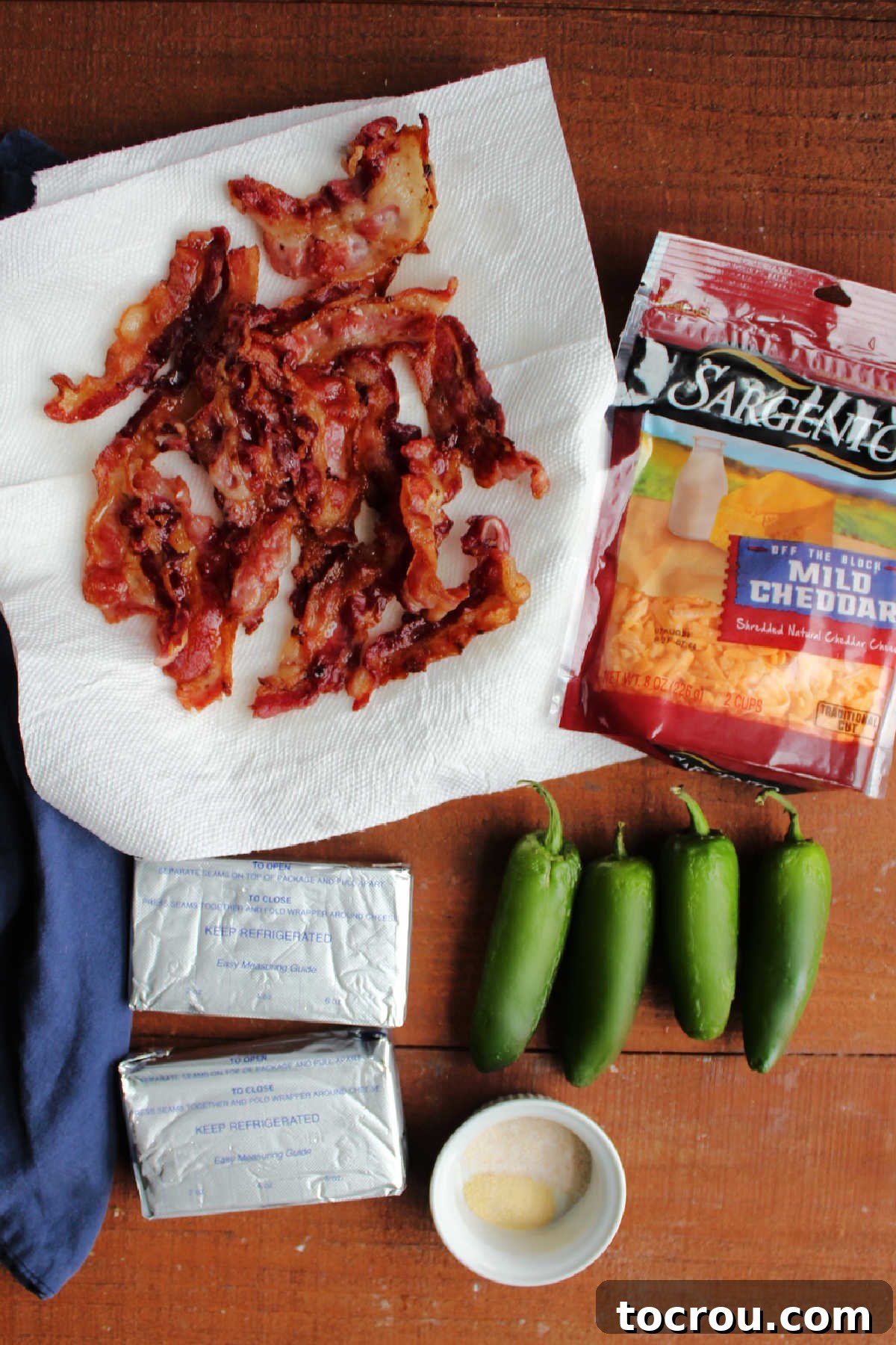 Zingy Bacon Jalapeno Cheese Ball 4 Ingredients including cream cheese, fresh jalapenos, crispy bacon, shredded cheddar cheese, garlic salt, and onion powder ready to be made into jalapeno popper cheese ball.