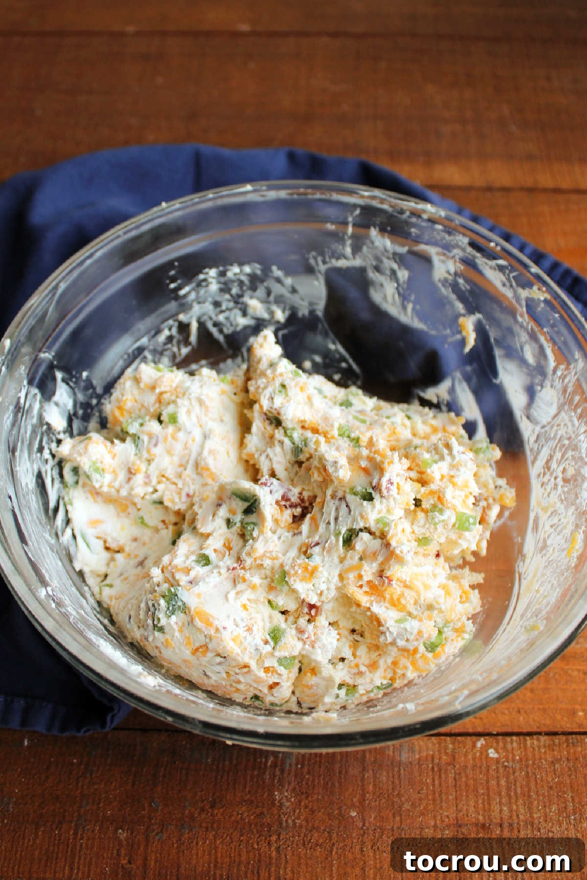 Zingy Bacon Jalapeno Cheese Ball 6 Jalapeno popper cheese ball mixture in mixing bowl.