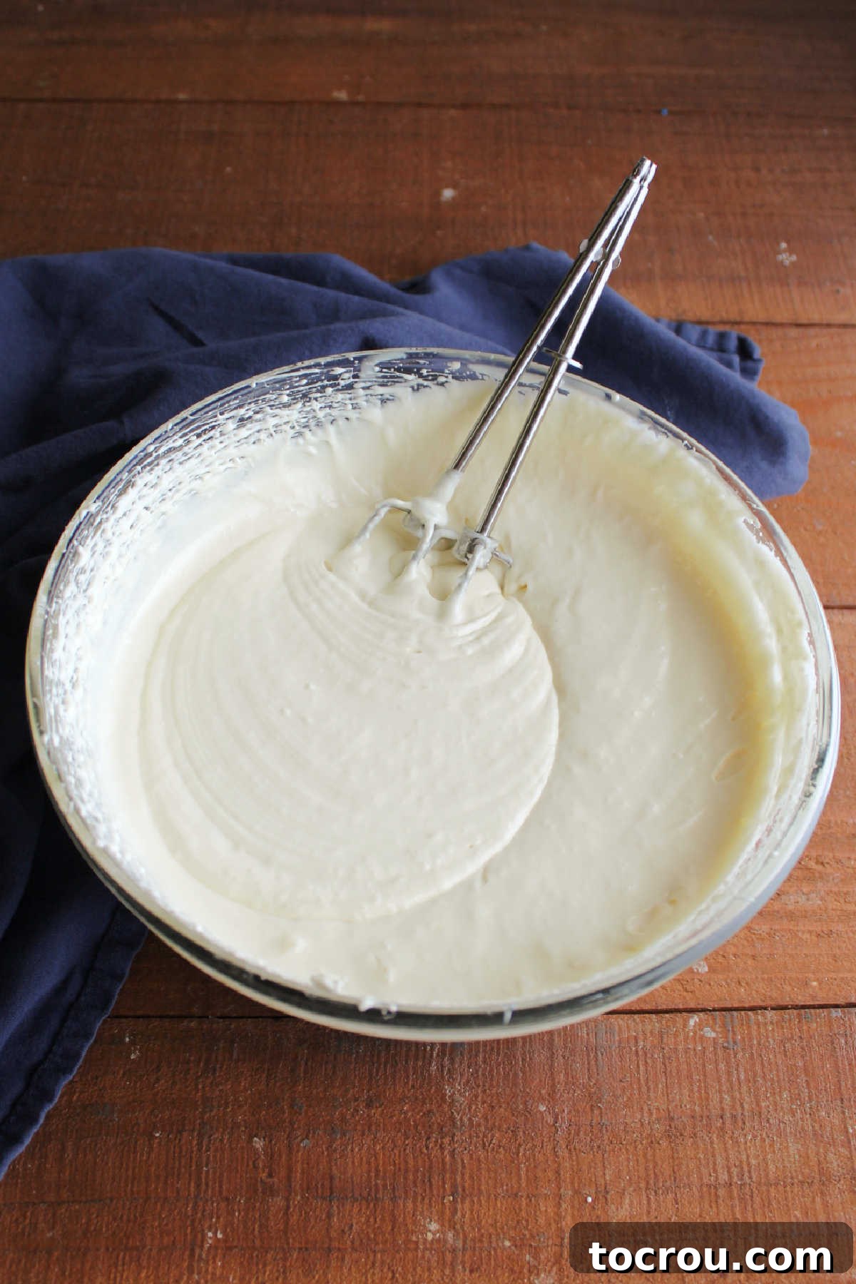 Fluffy orange mixture after heavy cream was added and whipped.