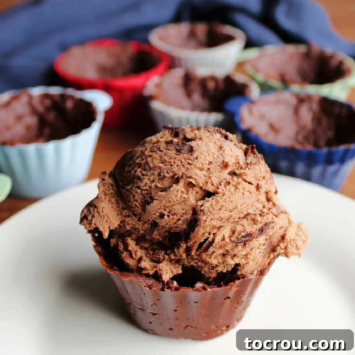 A fudgy chocolate ice cream cup, perfectly sized for a scoop of chocolate peanut butter ice cream, showcasing its rich texture and tempting appeal.