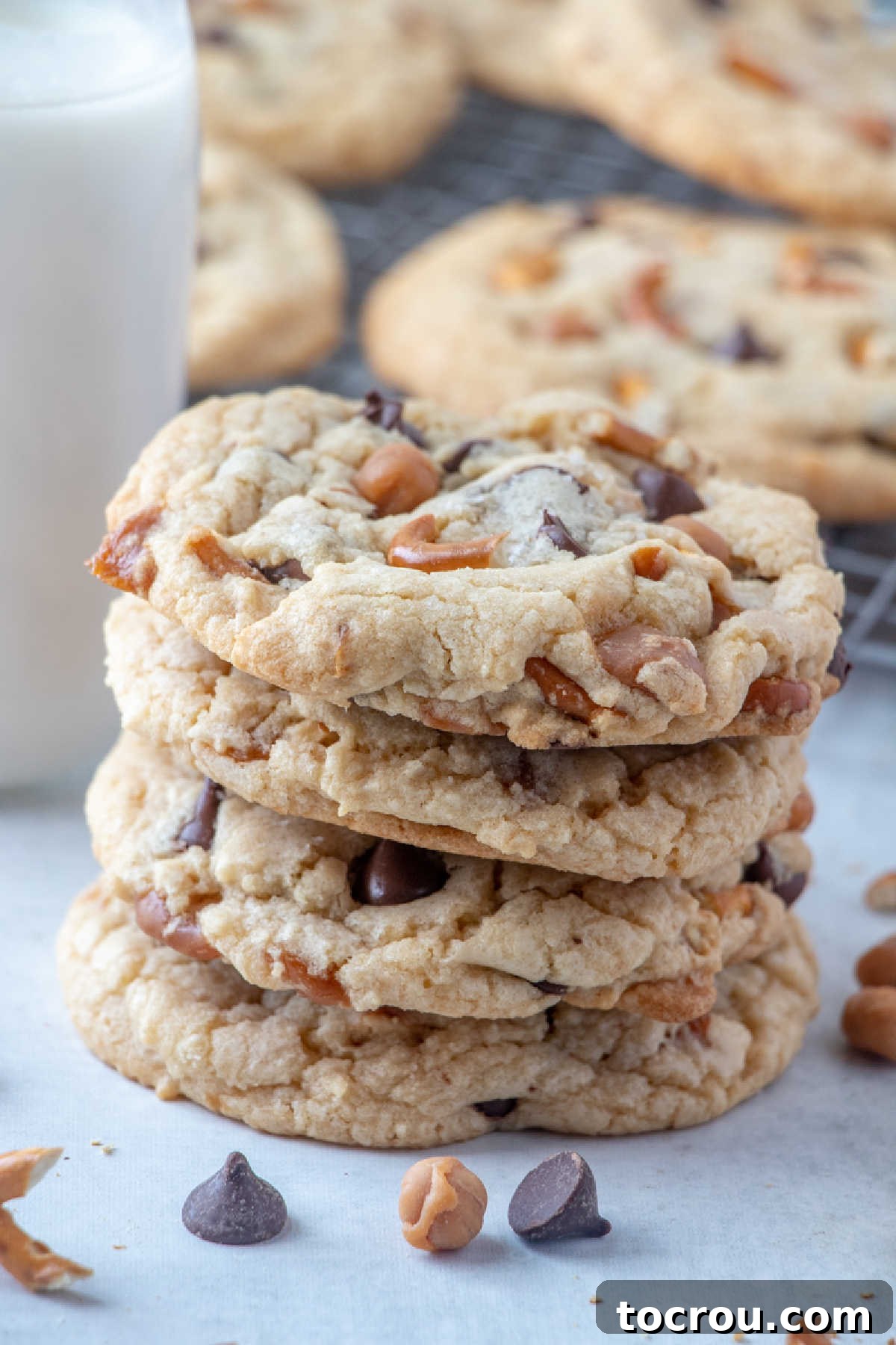 Delicious Stack of Kitchen Sink Cookies Stack of kitchen sink cookies with bits of caramel, pretzels, and chocolate chips inside.