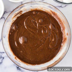 Mixing bowl of really soft cookie dough, ready to be chilled.