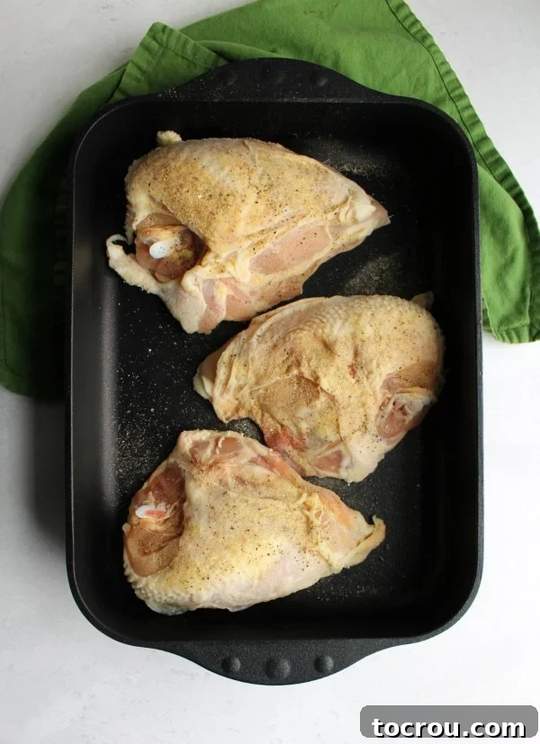 Seasoned Split Chicken Breasts in Roasting Pan seasoned split chicken breasts in swiss diamond roasting pan ready to go in oven.