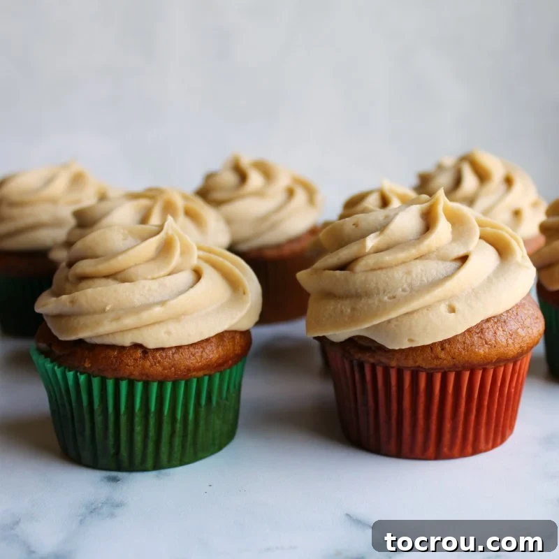 brown sugar german buttercream swirls on top of pumpkin cupcakes