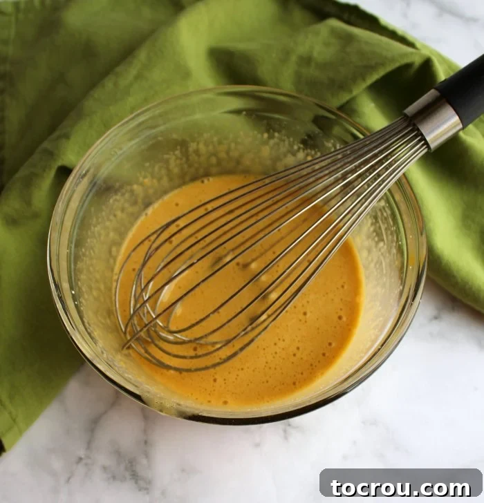 eggs whisked into brown sugar and cornstarch mixture for german buttercream