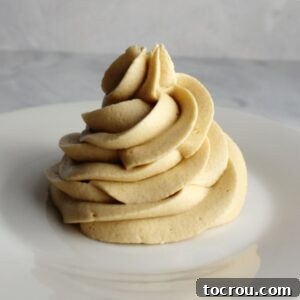 Swirl of brown sugar buttercream made with a custard base in the style of german frosting.