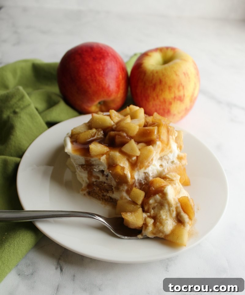 Luscious No-Bake Caramel Apple Cake 5 bite of creamy caramel apple icebox cake on fork, ready to eat.