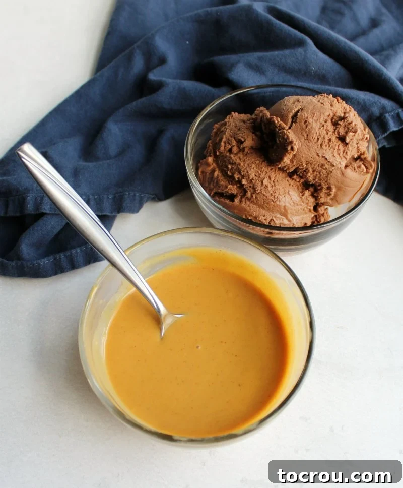 Bowl of creamy peanut butter magic shell in front of a bowl of chocolate nice cream, ready to be drizzled.