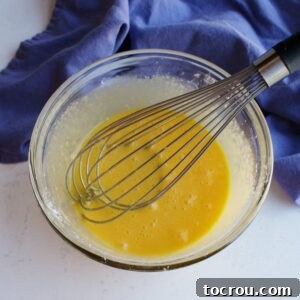 eggs beaten into sugar and cornstarch mixture in small bowl.