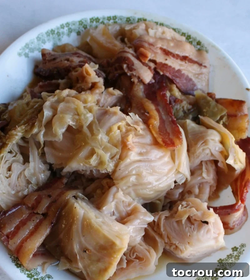 Beer Braised Cabbage Wrapped in Bacon 6 plate full of chunks of cabbage and bacon