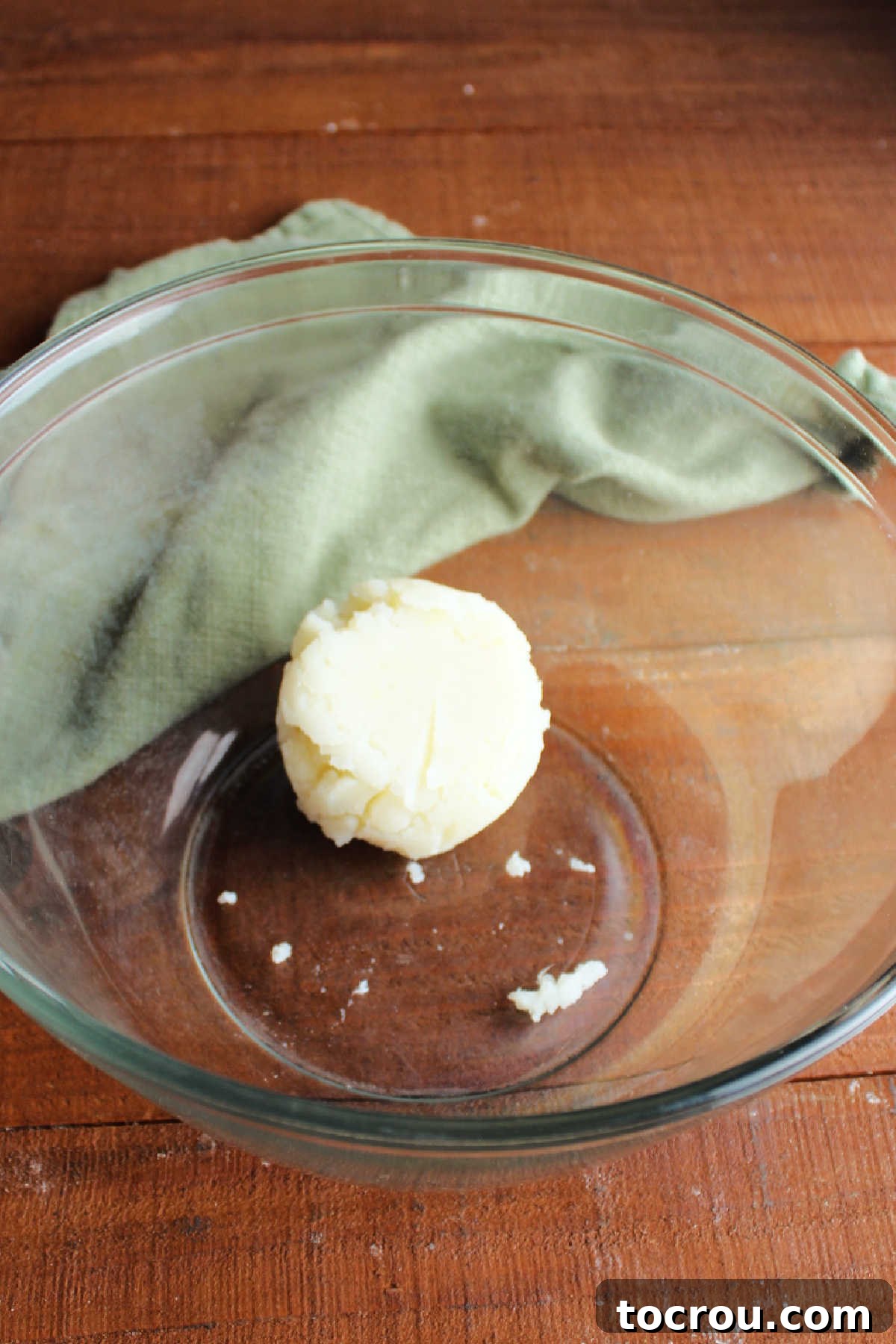 Plain Mashed Potatoes for Candy Mixing bowl with a half cup of mashed potatoes inside.