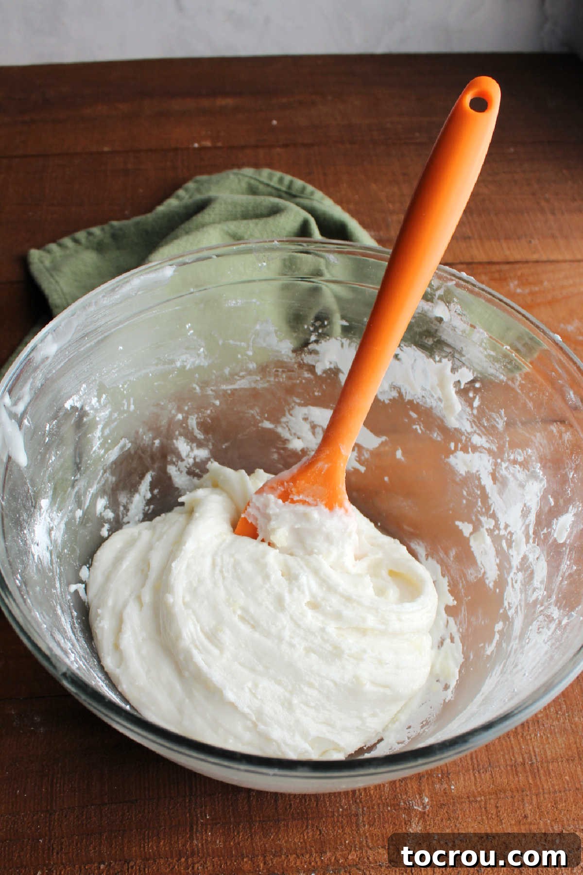 Potato Candy Dough Consistency Mixing bowl with thick putty consistency mixture of mashed potatoes, vanilla, and powdered sugar.