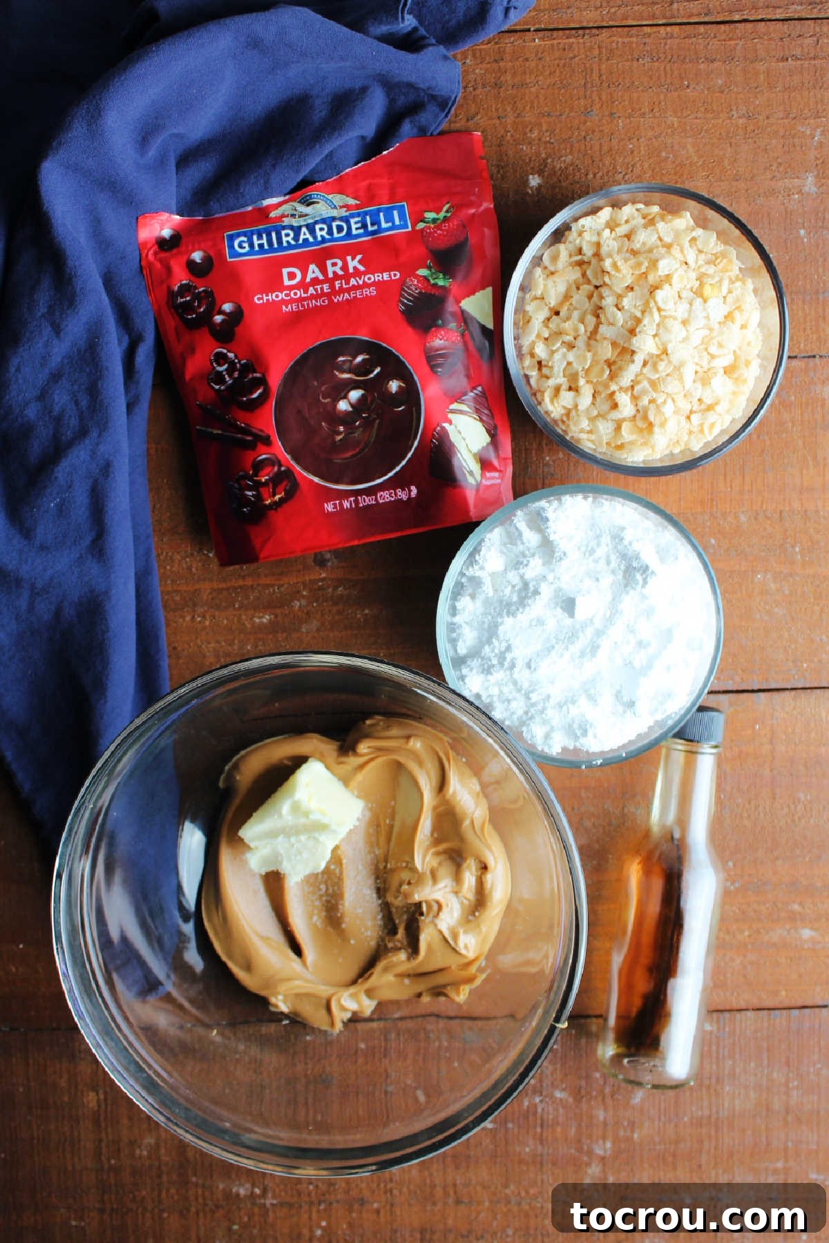 Rice Krispie Crunch Buckeyes 4 Ingredients including butter, peanut butter, salt, powdered sugar, vanilla, rice krispies, and dark chocolate ready to be made into candy.