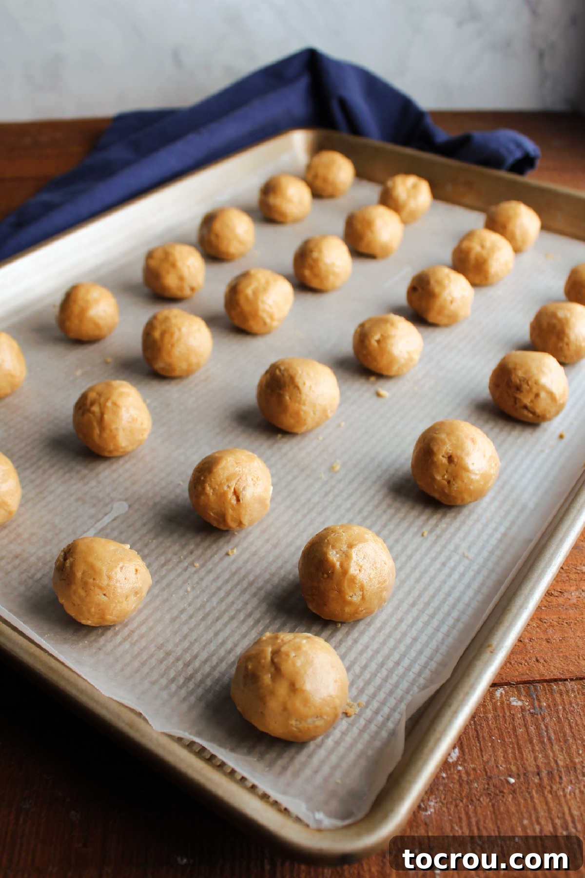 Rice Krispie Crunch Buckeyes 8 Chilled balls of dough showing smooth texture after they have been rolled between palms.