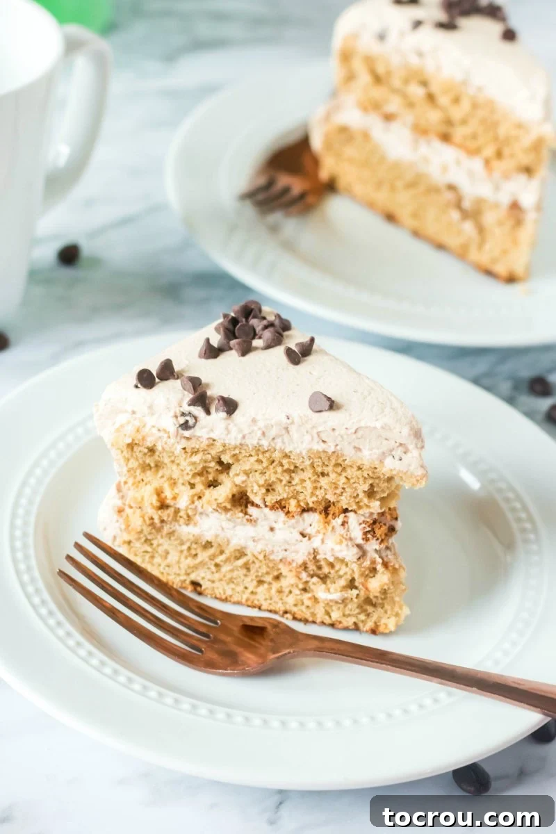 Cross-Section of Layers Close-up of multiple slices of layered coffee sponge cake, showcasing the rich brown coffee cake and abundant mocha whipped cream frosting.