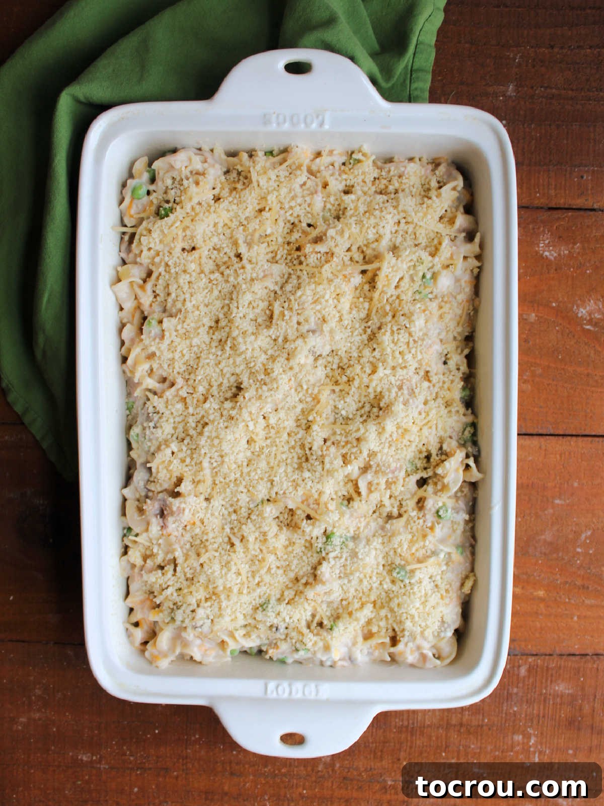 Hearty Tuna Noodle Casserole 8 Bread crumb topped tuna noodle casserole, ready to be baked in the oven until golden and bubbly.