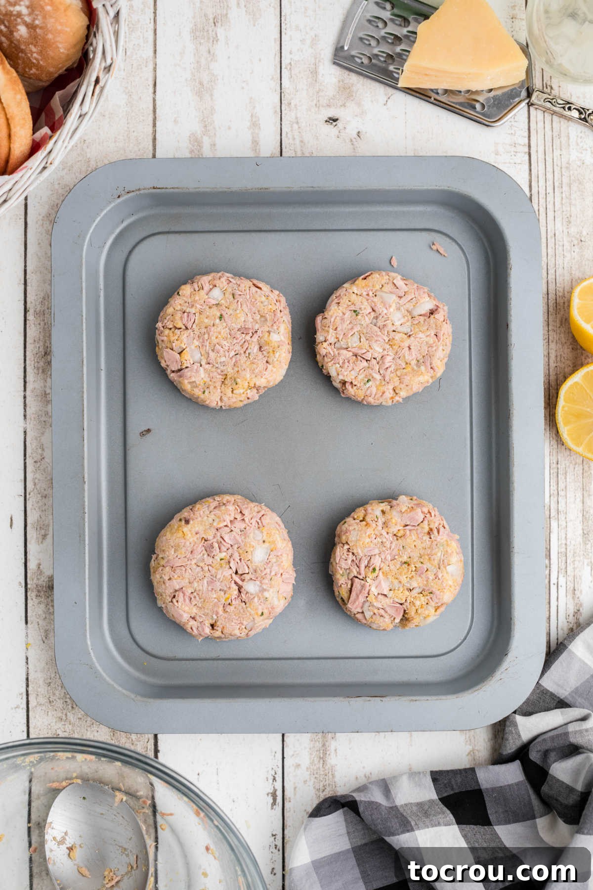 Tuna mixture formed into 4 burger patties, ready to be cooked.