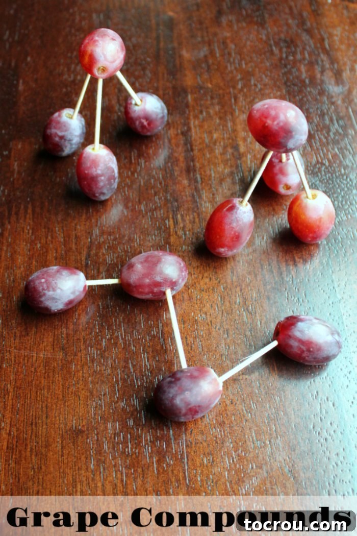 A close-up view of three distinct grape compounds, creatively linked together with toothpicks to simulate molecular structures.