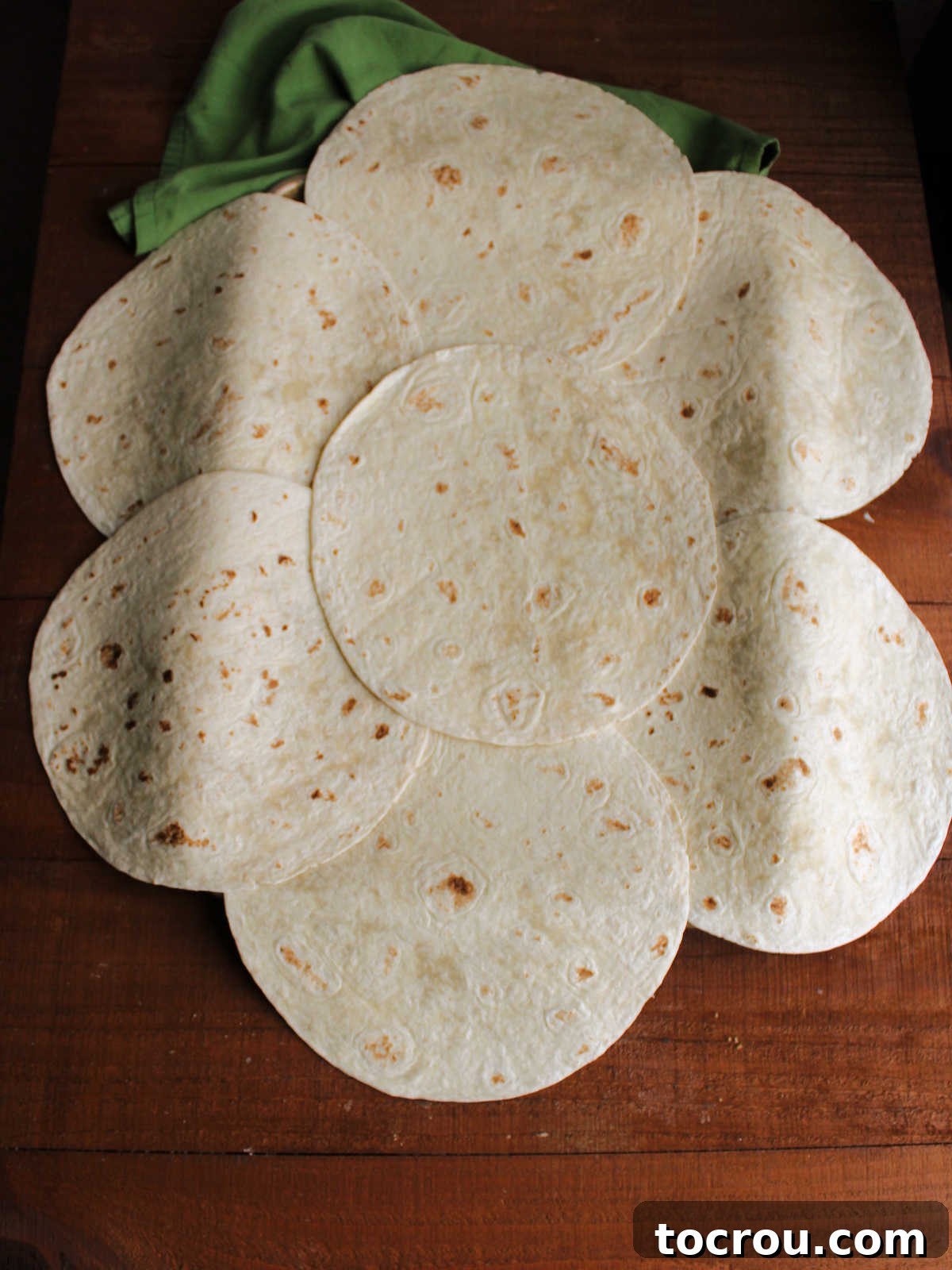 Sheet Pan Quesadilla Bake 4 Sheet pan covered with large tortillas to make the bottom of the quesadilla.
