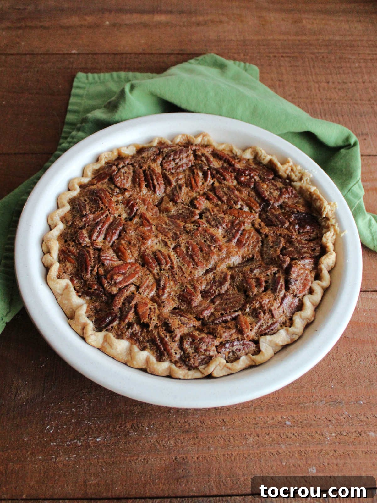 Timeless Pecan Perfection 6 Freshly baked pecan pie with golden brown crusty top filled with lots of nuts.