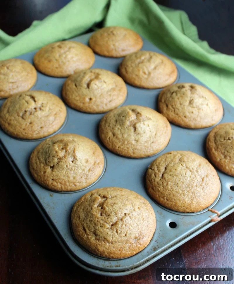 A tray of freshly baked sweet tea cupcakes, still warm from the oven.