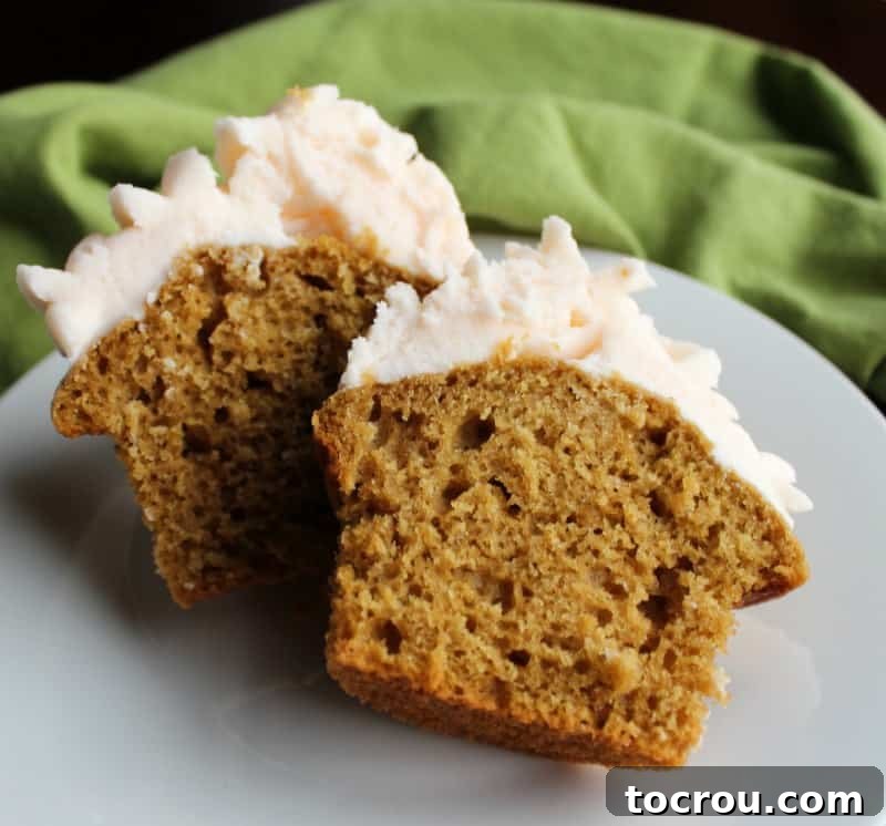 The interior of a homemade sweet tea cupcake, revealing its soft, tender texture and subtle brown tea color.