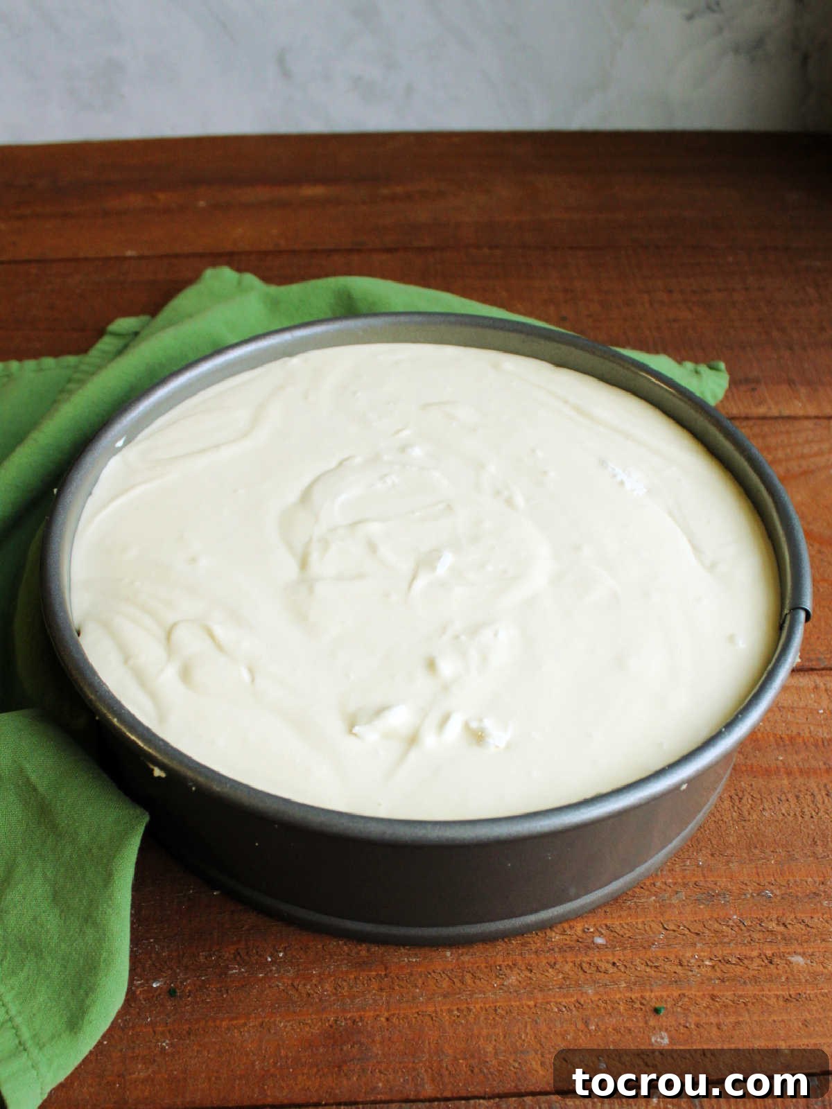 Cheesecake batter in springform pan, ready to go in the oven.