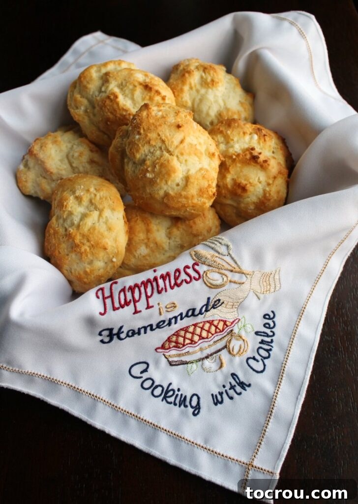 Basket of golden yogurt drop biscuits, ready to serve as a versatile base for sweet or savory creations.
