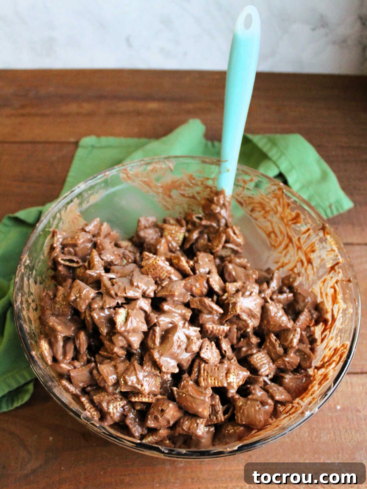 Cereal and pretzels coated in melted chocolate and peanut butter. 