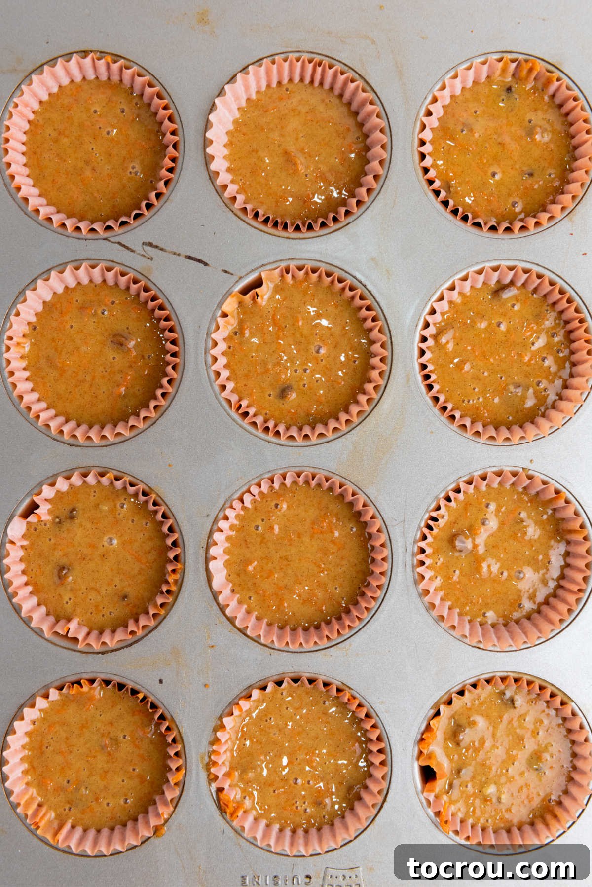 Rustic Carrot Cake Cupcakes 6 Cupcake batter in paper lined muffin tin, ready to bake.
